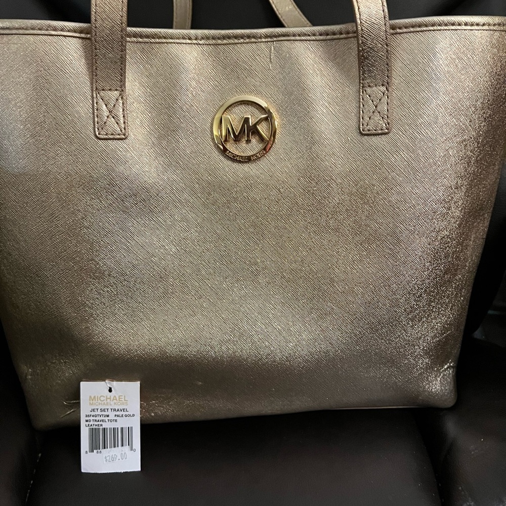 Gold metallic Michael Kors tote! Hardware and handles are in excellent shape!